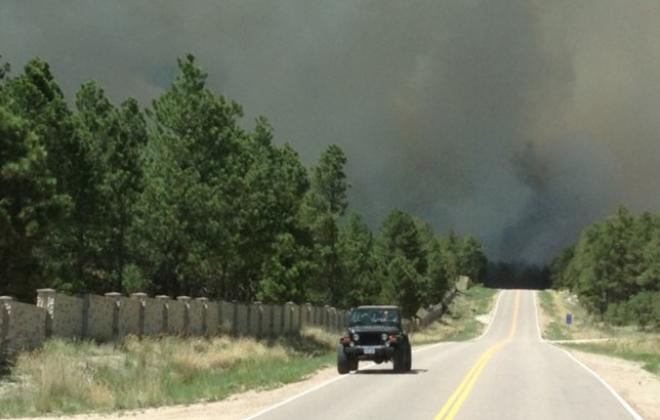 jeep driving away from fire